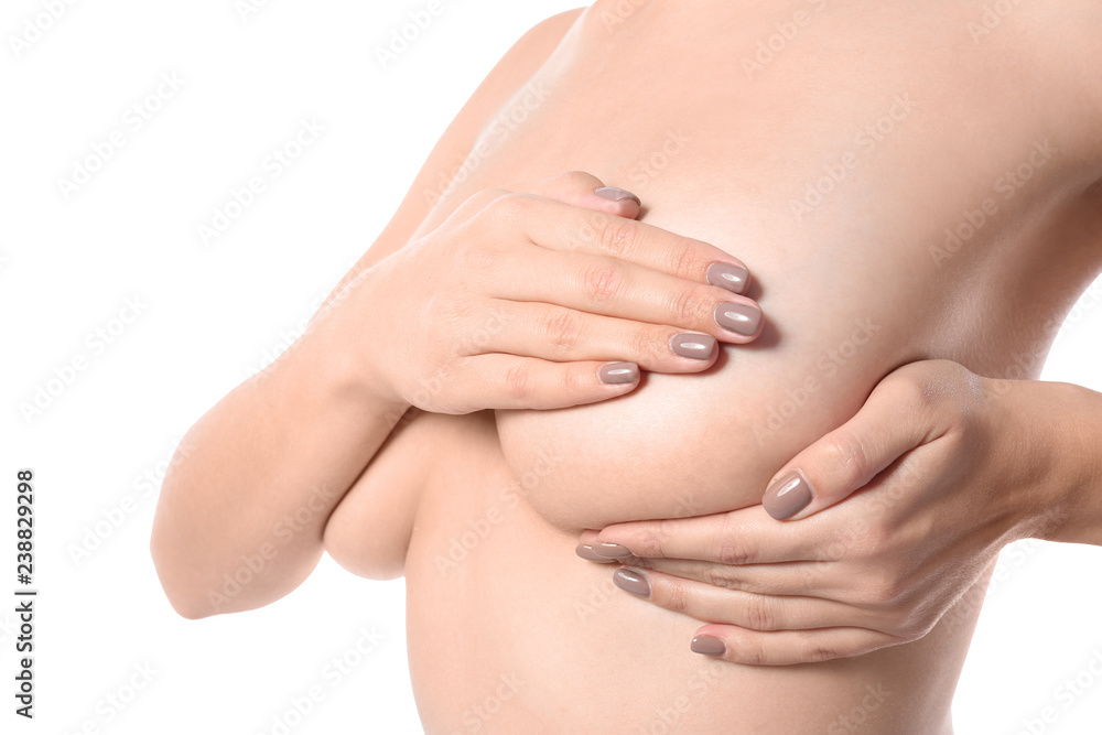 Woman checking her breast on white background, closeup Woman checking her breast on white background, closeup