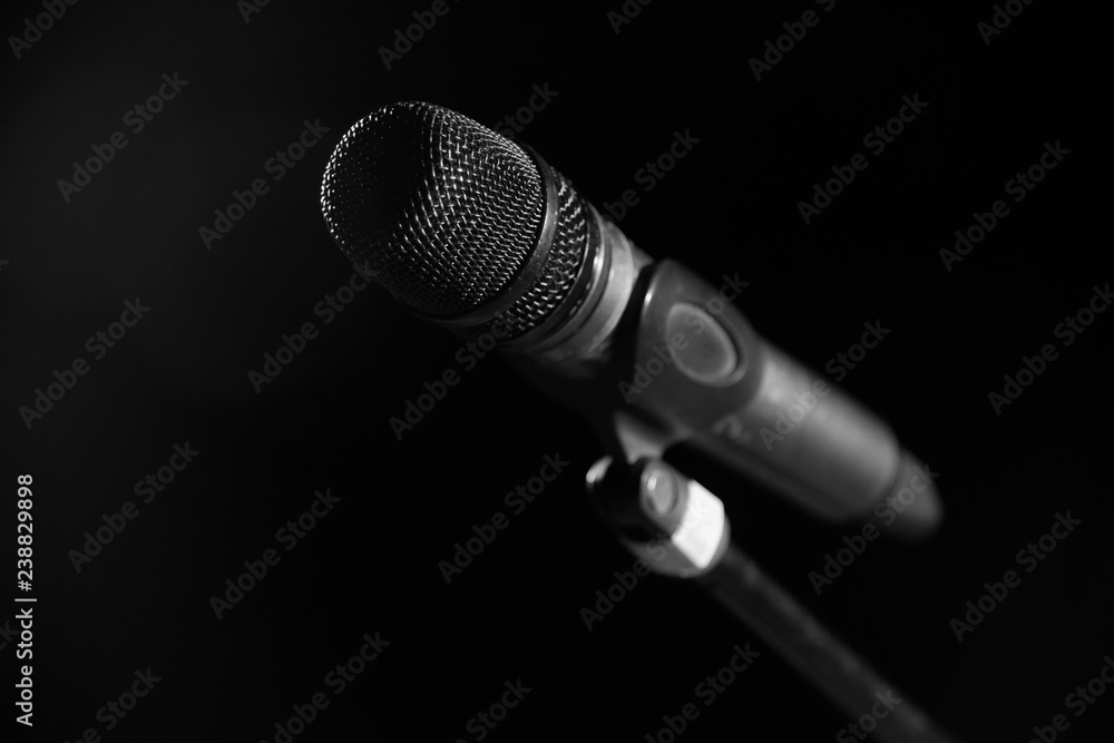 Closeup of microphone in concert hall or conference room Closeup of microphone in concert hall or conference room