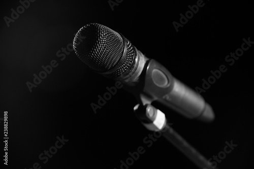 Closeup of microphone in concert hall or conference room