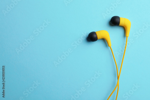 Stylish headphones on color background, top view. Space for text © New Africa