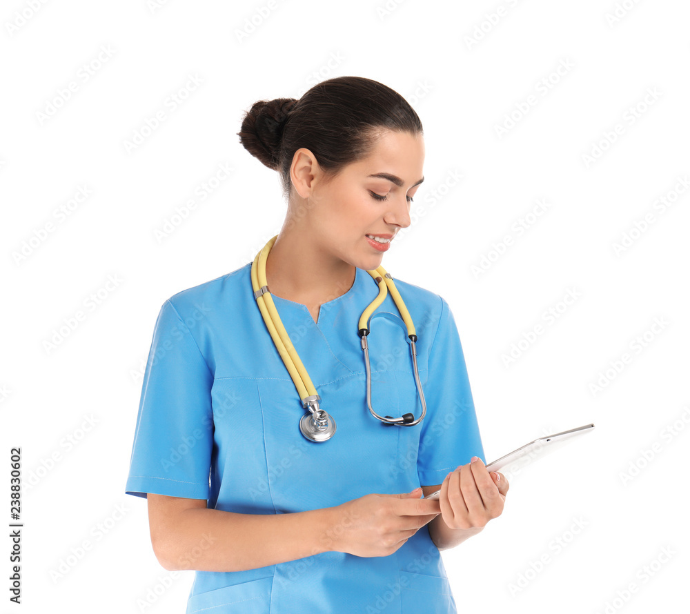Portrait of young medical assistant with stethoscope and tablet on white background Portrait of young medical assistant with stethoscope and tablet on white background