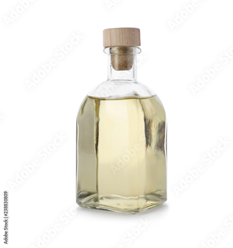 Glass bottle of apple vinegar on white background