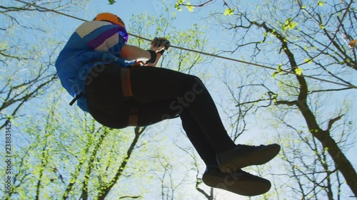 Wallpaper Mural Young man on a zip-line  Torontodigital.ca
