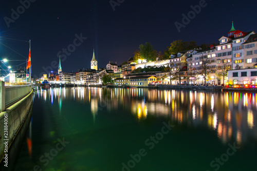 Zurich  Switzerland - Oct 13  2018   Beautiful view historic Zurich city center with famous Fraumunster Church and river Limmat in twilight.