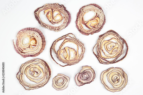 Dried salad onion slices on white background
