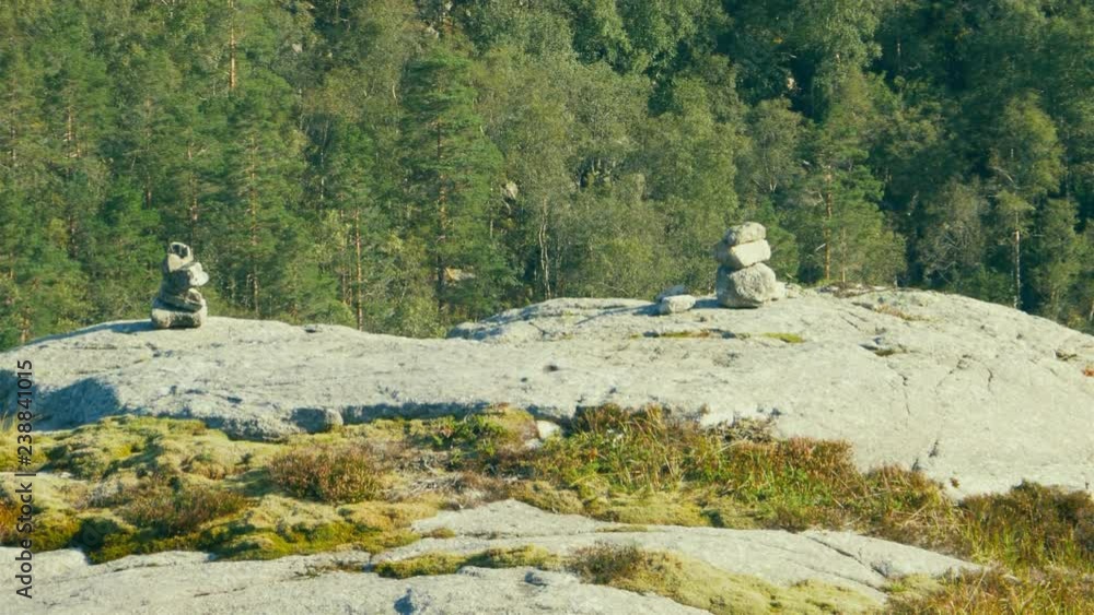 Staked Rocks Small rock stack on mountain trail, constructed by hikers and tourist ...