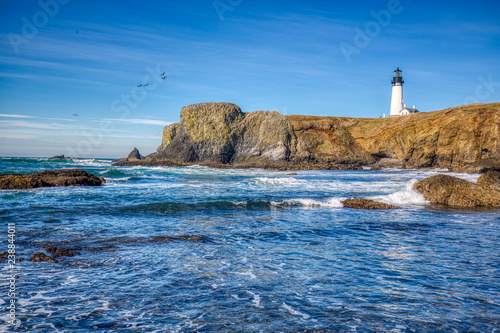 Yaquina Head Lighthouse, Newport, Oregon. The Lighthouse, at 93 feet (28 m) tall, is the tallest lighthouse in Oregon. Copy space frame left for text or graphics.