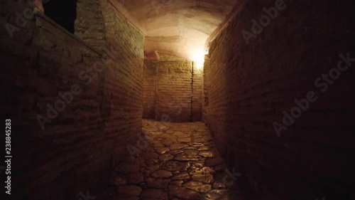 Walking through stone catacomb tunnels in Istanbul photo