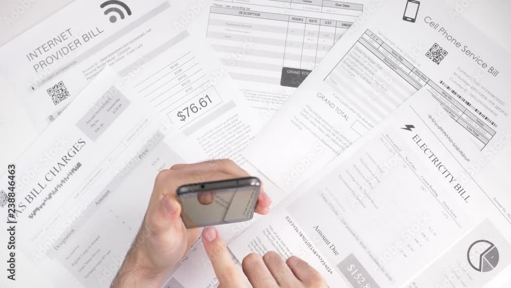 Paying bills using asmartphone. Online utility bills payment concept. Paying bills using asmartphone. Online utility bills payment concept.