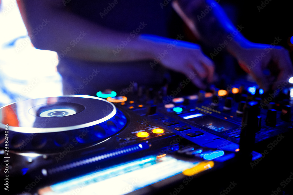 Obraz premium Dj mixes the track in the nightclub at party
