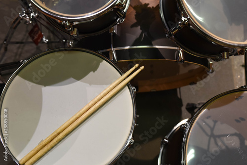 Closeup of drumsticks lying on the professional drum set. Drummer equipment. 