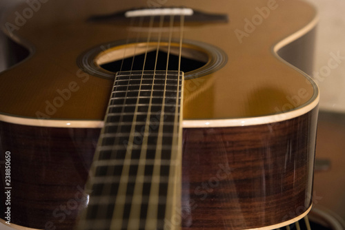 Closeup macro of abstract acoustic guitar and strings with copy space for text