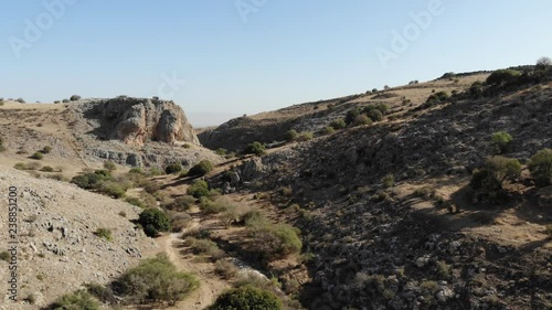 Tilt Down Dry River Roead Whit Cliffs And Trees photo