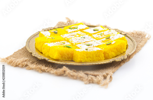 Indian Popular Sweet Food Khopara Pak or Coconut Burfi made up of Coconut, Milk And Sugar Isolated on White Background photo