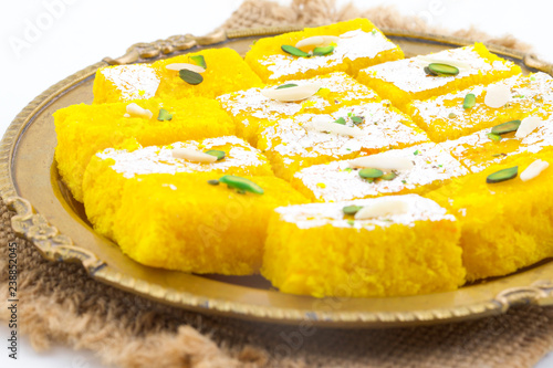 Indian Popular Sweet Food Khopara Pak or Coconut Burfi made up of Coconut, Milk And Sugar Isolated on White Background © Indian Creation