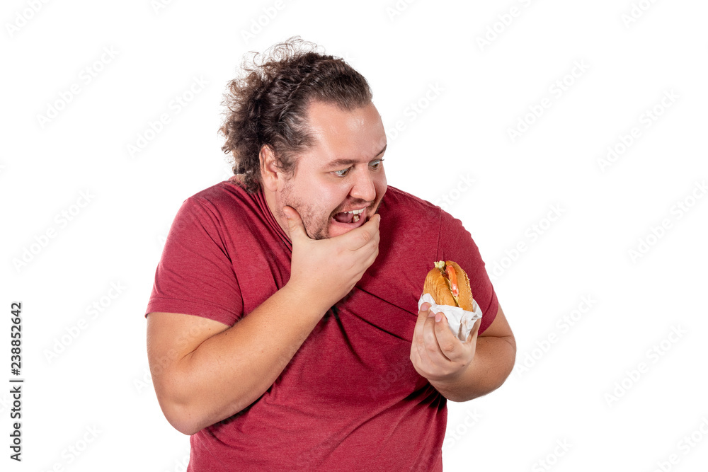 Funny fat man eating hamburger. Fast food, unhealty eat. Overweight and health problems Funny fat man eating hamburger. Fast food, unhealty eat. Overweight and health problems