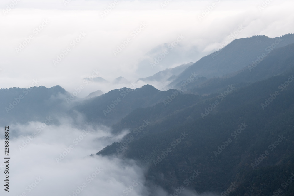 clouds and mists drifting in the valley