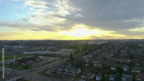 Drone descends over suburban Kitchener, Ontario homes at sunset photo