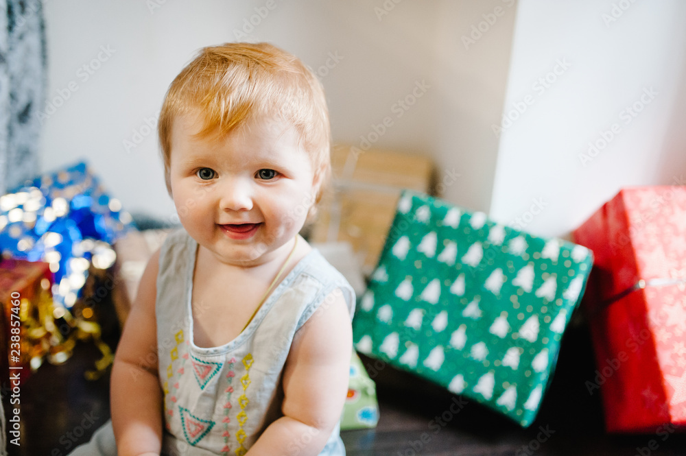 Portrait happy little girl with presents, sits on the background gifts. Festive birthday concept. baby on photo. infant. Women's Day, eighth of March. merry Christmas, happy holidays. new year. Portrait happy little girl with presents, sits on the background gifts. Festive birthday concept. baby on photo. infant. Women's Day, eighth of March. merry Christmas, happy holidays. new year.