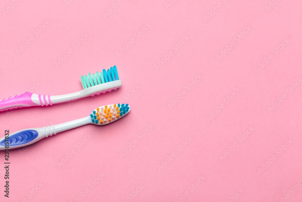 Toothbrushes on pink background Toothbrushes on pink background