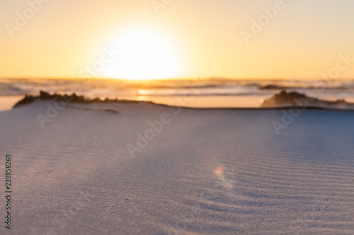 Beach sand with ripples and waves texture pattern