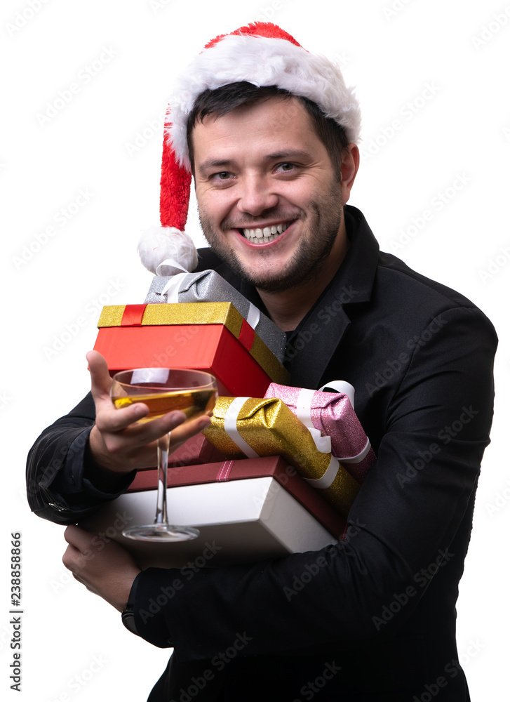 Photo of happy man in Santa's cap with boxes with gifts, with terminal Photo of happy man in Santa's cap with boxes with gifts, with terminal