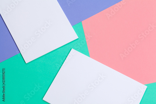Pile of colorful and white blank sheets of paper for your design, top view flat lay