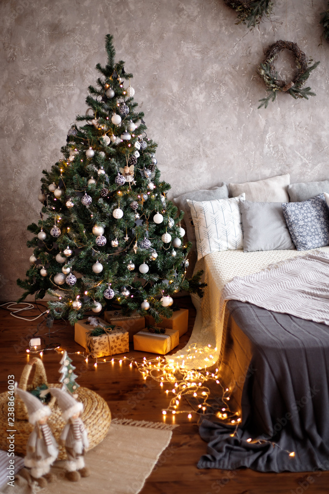 Christmas decorated bedroom interior. Cozy home moment. Concept Happy New Year