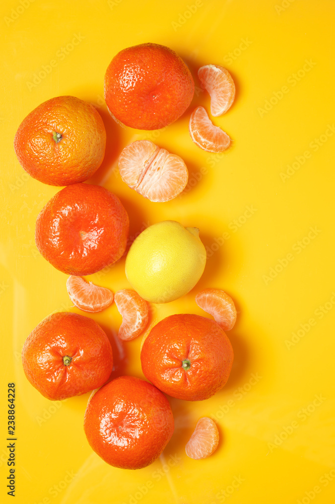 Tangerines on yellow background Tangerines on yellow background
