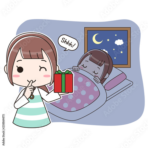 寝ている子供にプレゼントを置きに来たお母さん