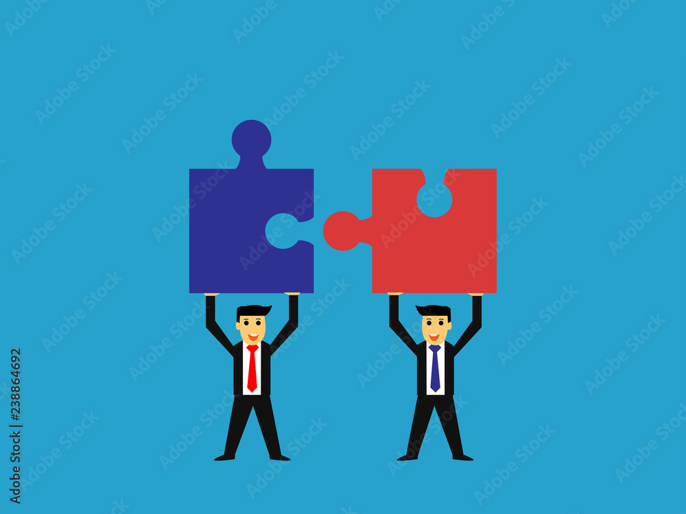 Fototapeta premium businessman raised jigsaw puzzle,business teamwork concept