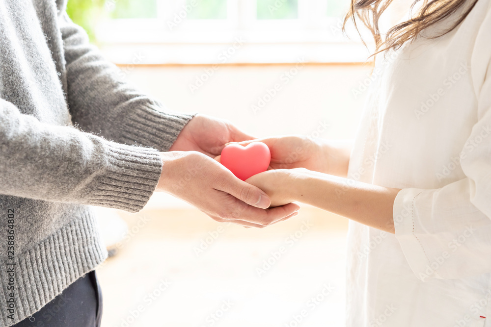 young asian woman holding heart symbol young asian woman holding heart symbol