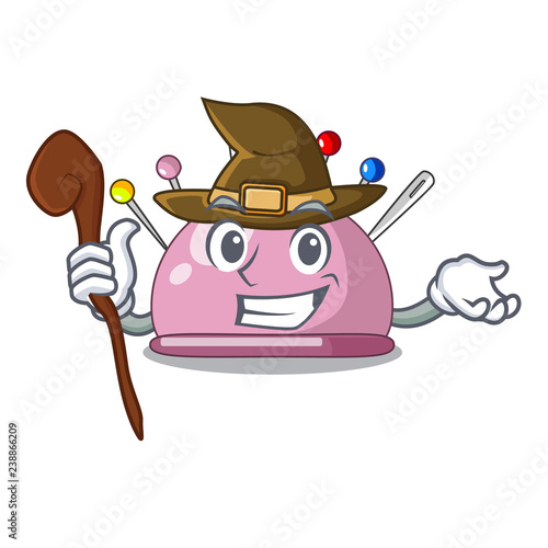 Witch sewing pins and pincushion on mascot