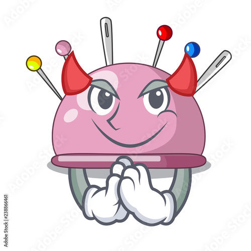 Devil sewing pins and pincushion on mascot