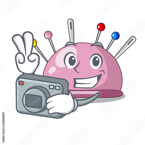 Photographer sewing pins and pincushion on mascot