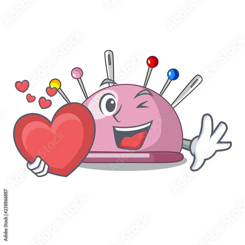 With heart sewing pins and pincushion on mascot