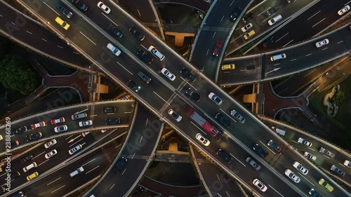 Abstract low angle drone shot of traffic driving over a busy intersection, a convergence of roads in central Shanghai city, China