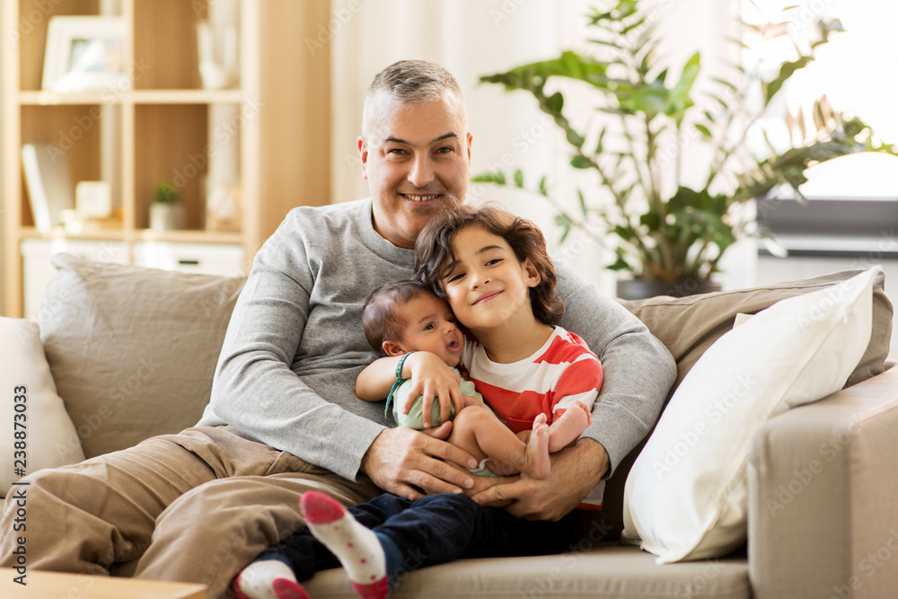 family, fatherhood and people concept - happy father with preteen and baby son at home family, fatherhood and people concept - happy father with preteen and baby son at home