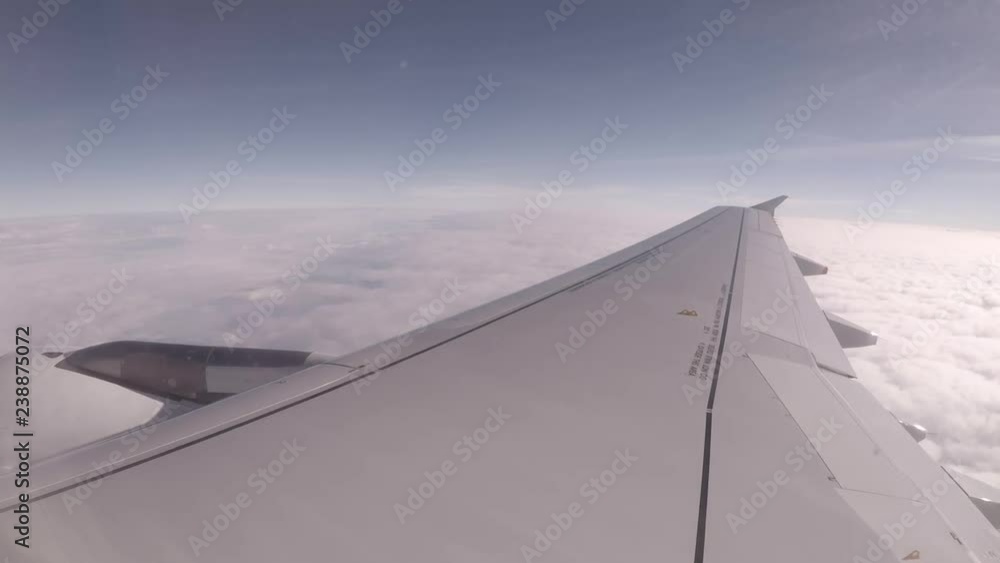 Passenger jet plane flying high through the clouds. Passenger jet plane flying high through the clouds.