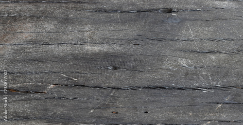 Old grunge dark brown wooden background. The surface of the old wood texture. Grunge wood pattern long walnut planks.