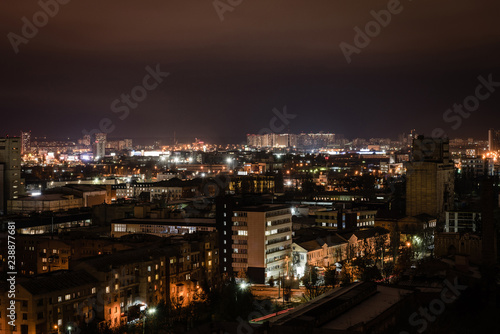 cityscape with illuminated buildings and streets at night