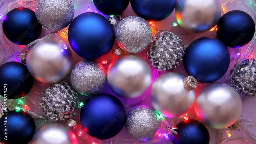 Christmas balls in blue and white colors wiht flashing lighted garland
Christmas balls in blue and white colors wiht flashing lighted garland