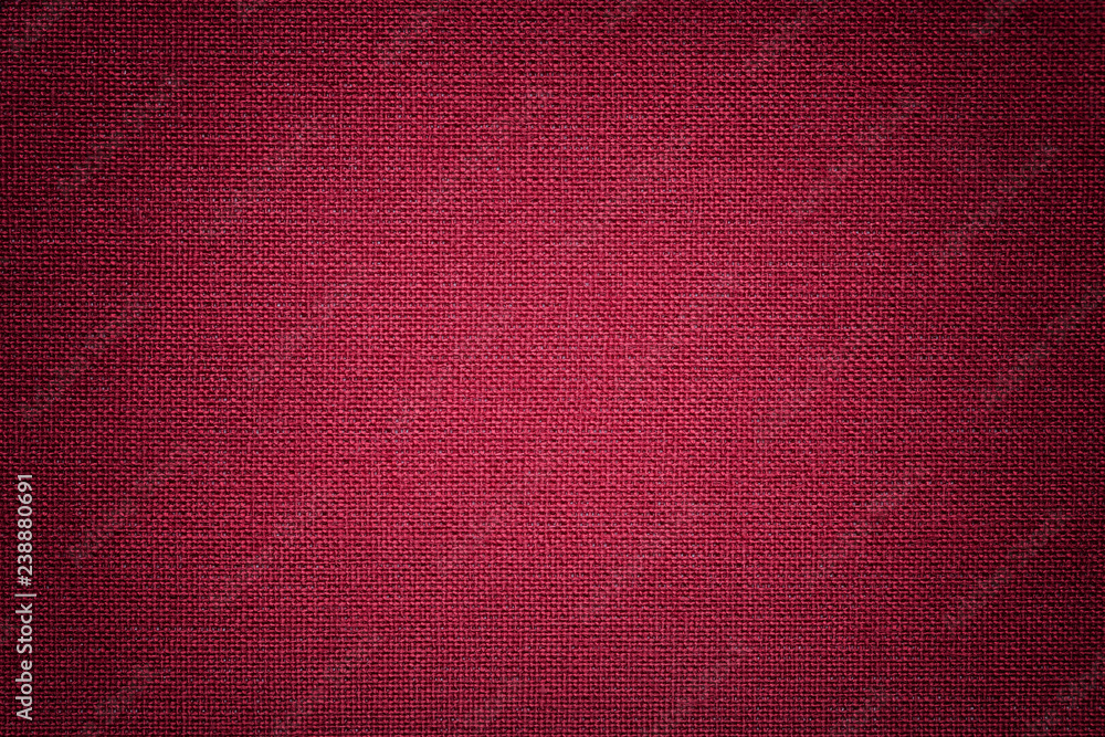 Fototapeta premium Dark red background from a textile material. Fabric with natural texture. Backdrop.