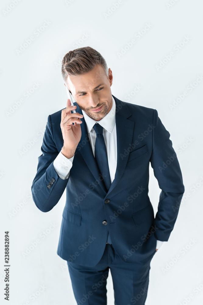 high angle view of handsome businessman in blue suit talking by smartphone isolated on white high angle view of handsome businessman in blue suit talking by smartphone isolated on white