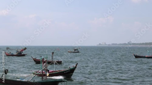 Coastal fishing boat parked on the beach. photo