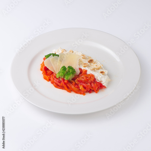Salad with Philadelphia cheese, vegetables and parmesan. Isolated on white background.