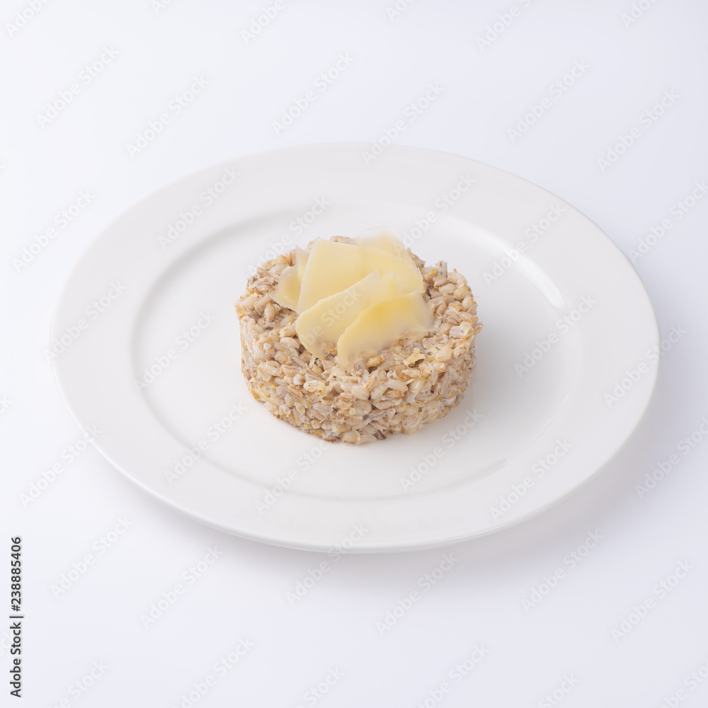 Cooked buckwheat porridge on plate. Isolated on a white background, Cooked buckwheat porridge on plate. Isolated on a white background,