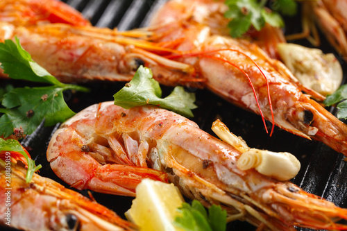 Grilled shrimps with spice, garlic and lemon. Grilled seafood. Langoustines.