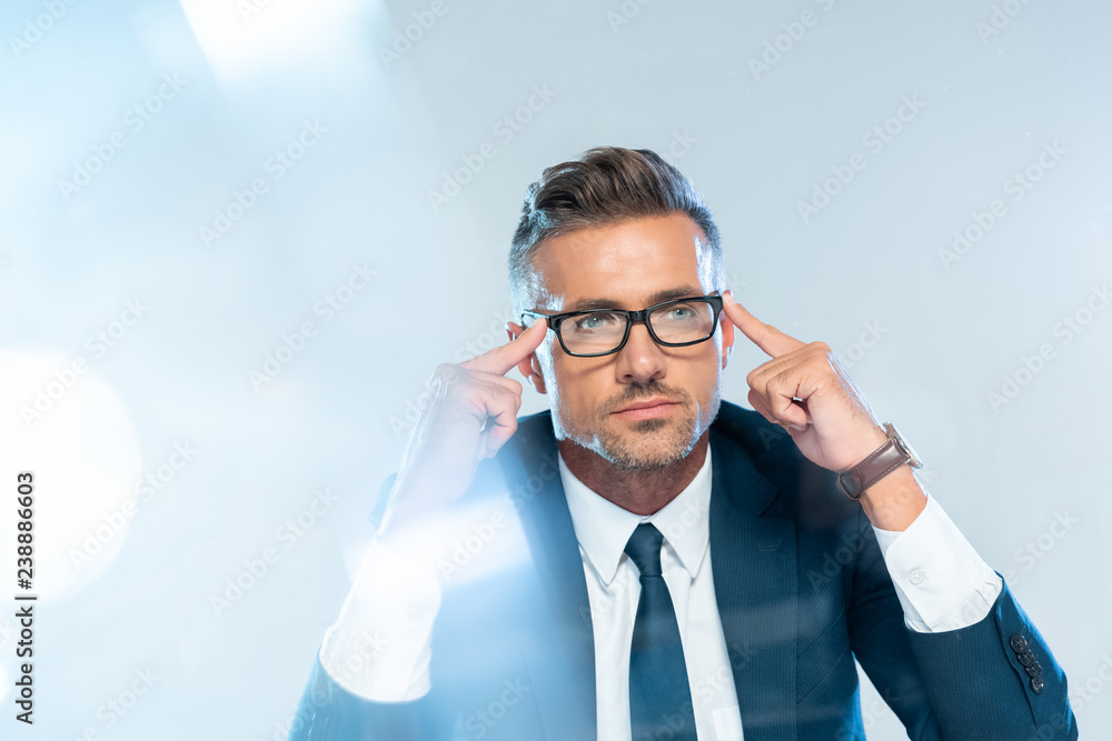 handsome businessman in glasses touching head isolated on white, artificial intelligence concept handsome businessman in glasses touching head isolated on white, artificial intelligence concept