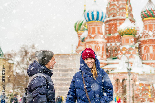 portrait of young lovers couple walking in the moscow historic city travel in europe during winter f